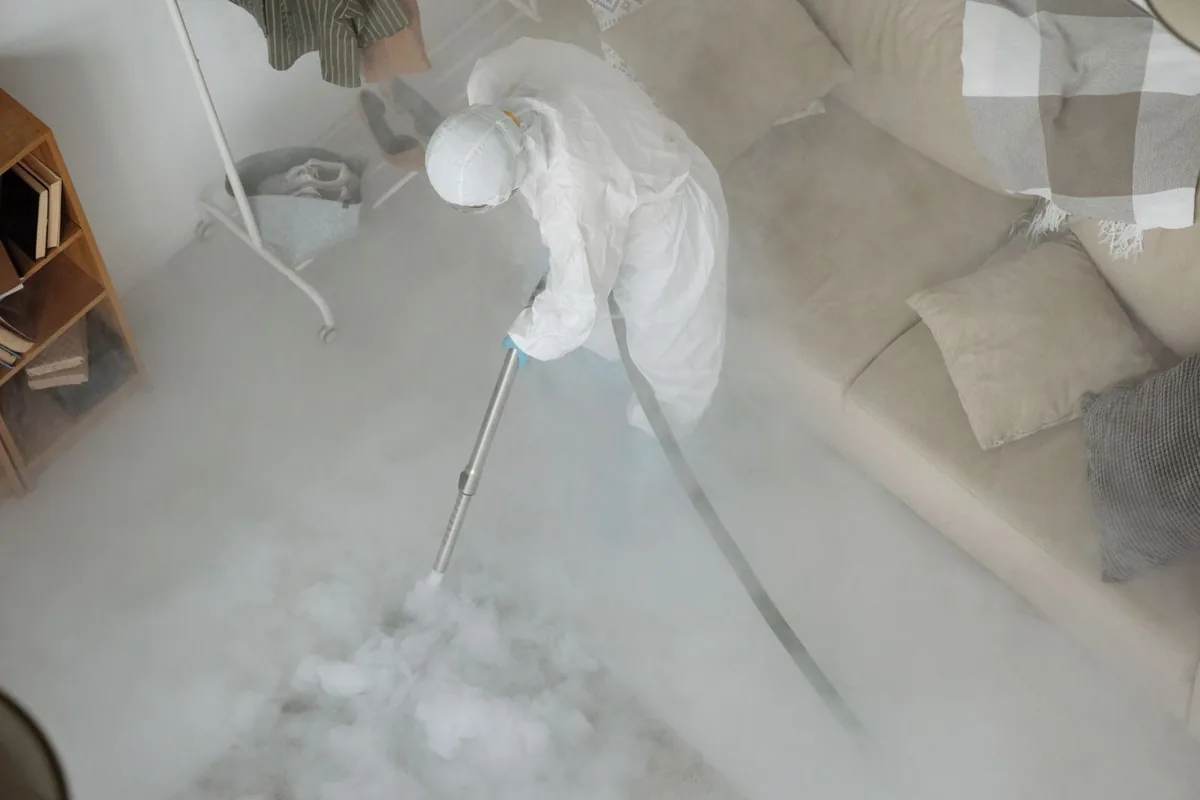 Biohazard cleanup technician in protective equipment, Parkersburg, WV